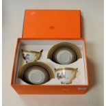 A pair of Hermes Cheval D'Orient teacups and saucers, in original Hermes box