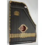 An early 20th century German zither bearing a label US Guitar & Zither Company, Oscar Schmidt Guitar