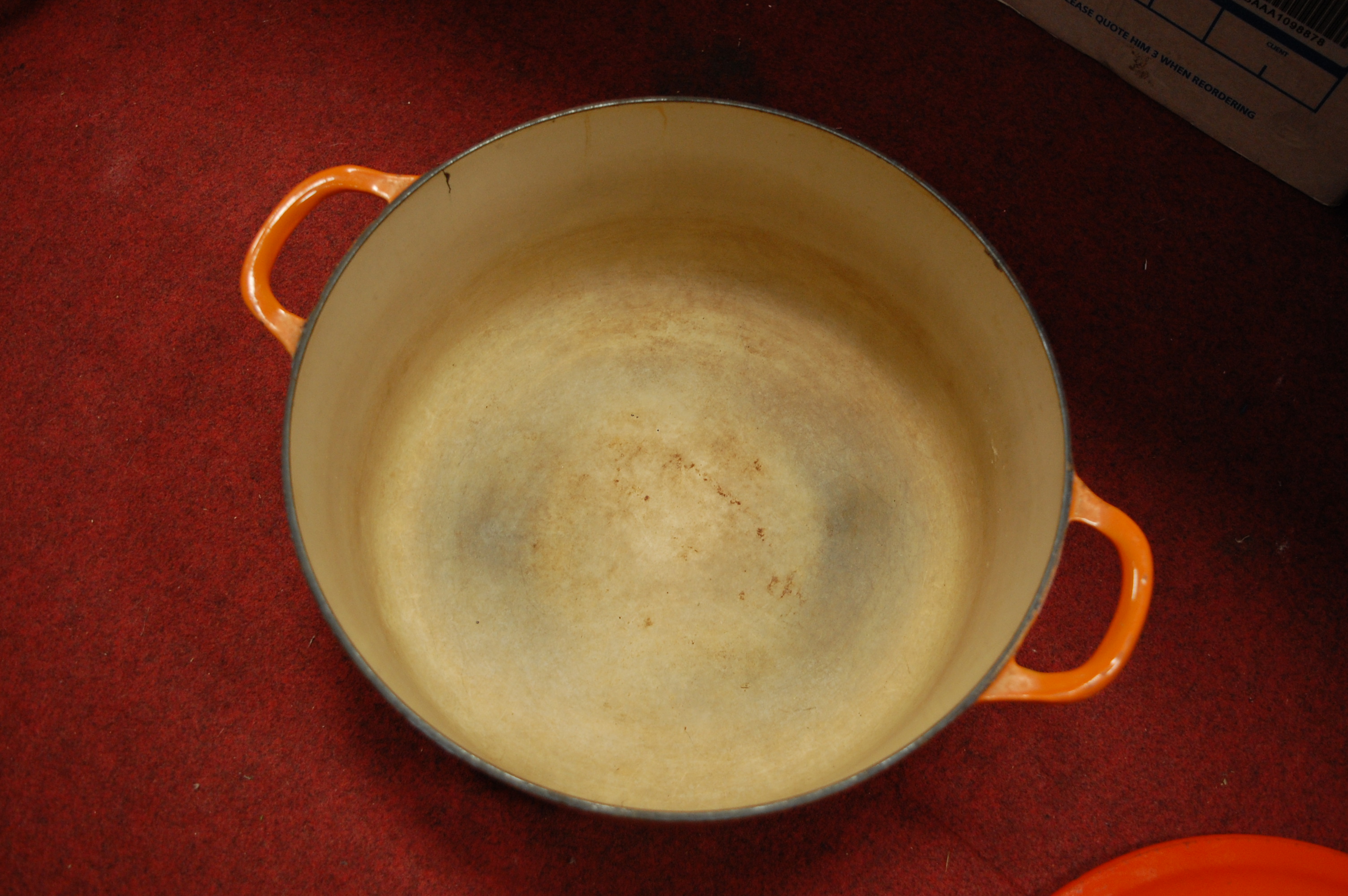 A Le Creuset orange enamelled casserole dish and cover together with one other smaller example (2) - Image 9 of 12