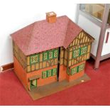 A 1960s mock Tudor two storey dolls house, width 65cm