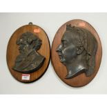 A modern cast metal profile plaque of Queen Victoria on oval plinth, together with one other of