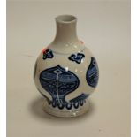 A Chinese stoneware vase of squat baluster form with underglaze geometric and Greek key design,