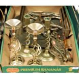 A box of miscellaneous brass wares to include a pair of spirally turned candlesticks, pair of lyre