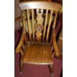 An early 20th century fruitwood and beech splatback farmhouse rocking armchair, width 58cm