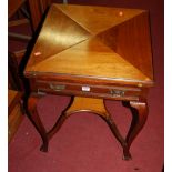 An Edwardian walnut envelope card table, having single frieze drawer and raised on slender cabrole