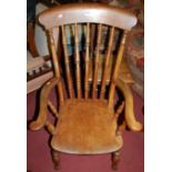 An early 20th century elm and beech stick back farmhouse open armchair, width 63cm, together with