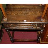 A 19th century joined oak plank top single drawer side table, raised on turned and square cut