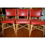 A set of four Art Deco beech and red vinyl pad back and seat dining chairs by A.J. Allen of Baker