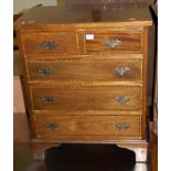 A mahogany and satinwood crossbanded chest of two short over three long drawers, width 62cm