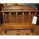 A Victorian figured walnut and satinwood strung three division Canterbury, having turned balustrades