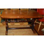 An early Victorian mahogany round cornered hall table, raised on shaped and pierced end supports