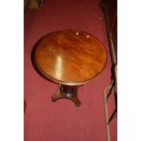 A Victorian mahogany circular topped low occasional table, dia. 53cm