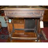 An early 20th century oak single drawer side table raised on turned square supports, united by lower