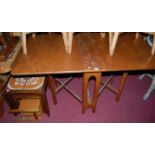A 1970s teak dropleaf dining table, length 144cm; together with a teak and tile-top inset nest of
