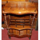 An early Victorian rosewood serpentine front Canterbury whatnot, having spiral turned columns, three