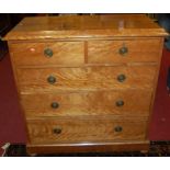 A Victorian satinwood square front chest of two short over three long graduated drawers, raised on