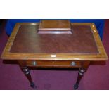 A Victorian mahogany round cornered single drawer writing table, having tan rexine inset top surface