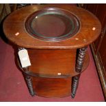 A Victorian mahogany oval three-tier wash stand, raised on bobbin turned supports (lacking ceramic