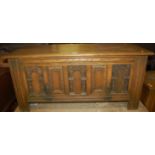 A contemporary moulded oak hinge top blanket box, having a fall-front panel, width 114cm