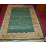 A contemporary machine woven woollen green ground rug, 205 x 144cm
