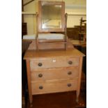 An Edwardian faded walnut swing mirror back three drawer dressing chest, width 81cm