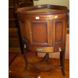 A 19th century mahogany corner wash stand, having single cupboard door to platform undertier,