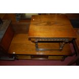 A contemporary Old Charm oak rectangular low coffee table, having single linenfold central