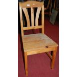 A set of six modern pine panelled seat dining chairs