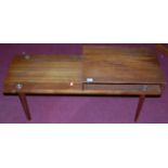 A 1970s Danish teak low two-tier occasional table, w.100cm