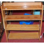 A 1950s oak low free standing open bookshelf, width 77cm