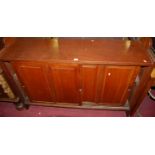 An early 20th century walnut side cupboard, having twin recess panelled sliding doors, width 137cm