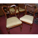 A set of six early Victorian mahogany balloon back dining chairs, having upholstered drop-in pad