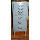 An industrial grey painted metal narrow tool chest of seven graduated drawers, width 28cm