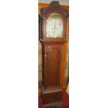 A circa 1800 provincial oak long case clock, having a painted arch dial with subsidiary seconds hand