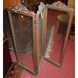 An early 20th century French oak framed and clear glass inset three division low screen, having