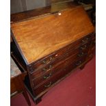 An early 19th century mahogany slopefront four drawer writing bureau, having a fitted interior and