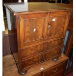 A Victorian mahogany commode in the form of a side cupboard, having hinged lid and twin upper doors,