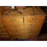 A 19th century rustic pine square front chest of two short over three long graduated drawers,