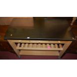 A contemporary beech and polished stainless steel topped portable kitchen preparation trolley,