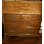 A 1930s mahogany slopefront writing bureau, having two short over two long drawers, width 86cm