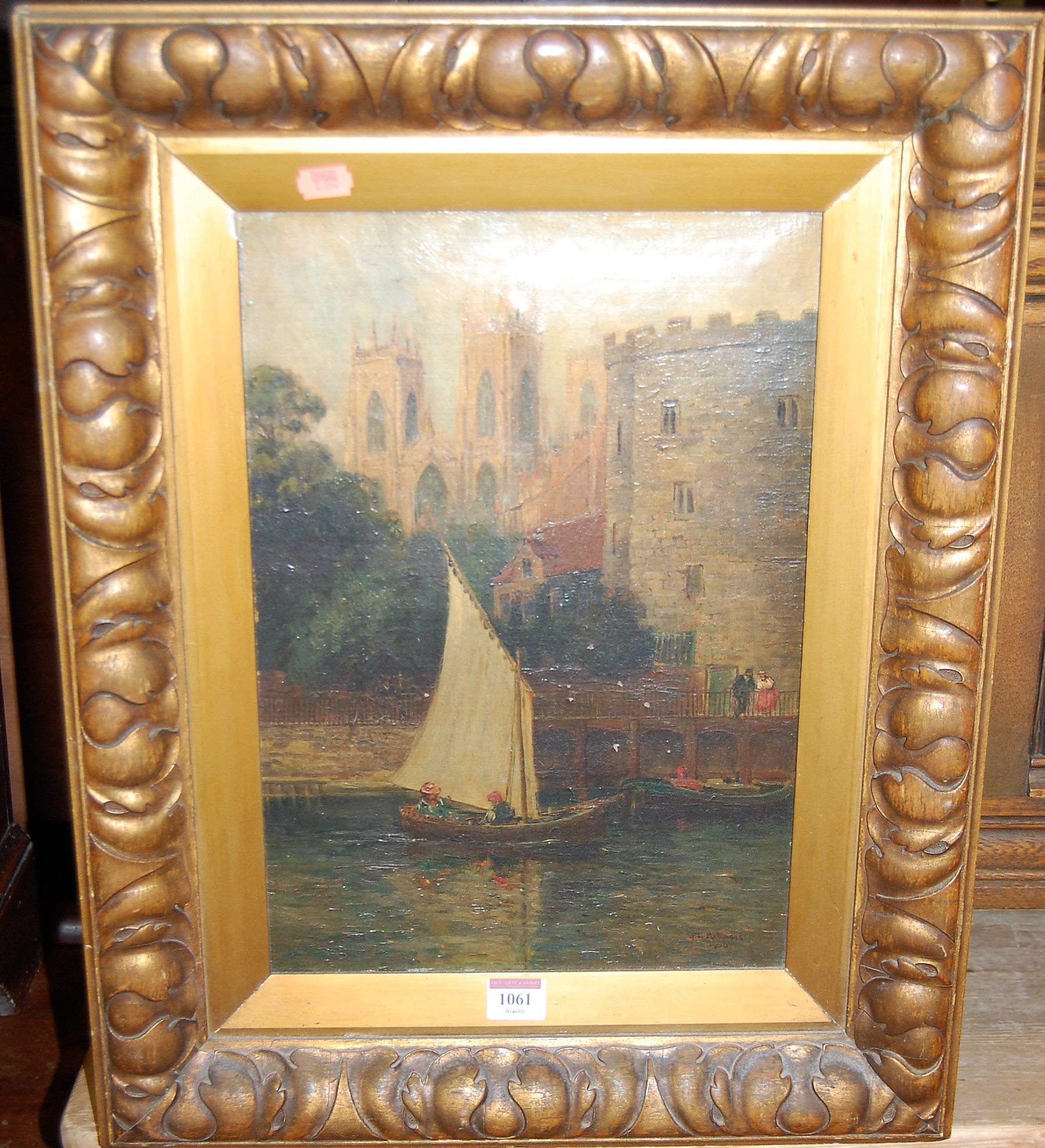 GL Robinson - sailing boat on the river before a cathedral, oil on canvas, signed and dated lower