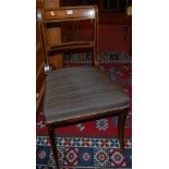 A pair of Regency mahogany and ebony inlaid bar back dining chairs, each with reupholstered stuff