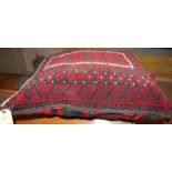A Turkish floral geometric stylised embroidered seat cushion, 60 x 50cm