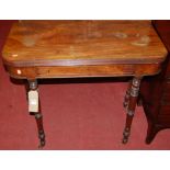 An early 19th century mahogany round cornered fold-over card table, having a reeded edge and