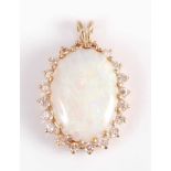 A yellow metal, opal and diamond cluster pendant, the oval cabochon cut opal measuring approx 18.4 x