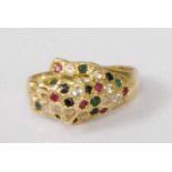 A contemporary 18ct gold multi-stone leopard head ring, the leopard head and fore-paw set with small