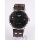 A Gents Tissot Swissmatic steel self-winding wristwatch, having round black baton dial with date