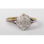 An Art Deco 18ct gold and platinum diamond dress ring, the pavé set eight old round cut diamonds