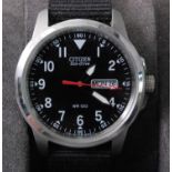 A gent's Citizen Eco-drive steel cased quartz wristwatch, having a signed black dial, day-date