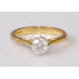 An 18ct gold diamond solitaire ring, the six claw set brilliant weighing approx 0.65 carats, 4g,